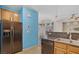 Kitchen with stainless steel appliances and blue accent wall at 8261 Peaceful Mountain Ave, Las Vegas, NV 89178