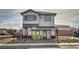 Two-story modern home with gray exterior and dark gray accents at 8405 Sycamore Creek St, Las Vegas, NV 89148