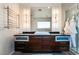 Contemporary bathroom with dark wood vanity, large mirror, and modern lighting at 900 Las Vegas Blvd # 904, Las Vegas, NV 89101