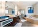 Modern bathroom with soaking tub, walk-in shower, and dark wood vanity at 900 Las Vegas Blvd # 904, Las Vegas, NV 89101