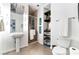 Modern bathroom with white pedestal sink, glass shower, and built-in shelving at 900 Las Vegas Blvd # 904, Las Vegas, NV 89101