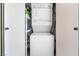 Stackable washer and dryer in a closet with additional shelving at 900 Las Vegas Blvd # 904, Las Vegas, NV 89101