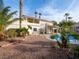 Large backyard with a sparkling pool and desert landscaping at 908 Primrose Ln, Henderson, NV 89011