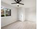 Spacious bedroom with ceiling fan and large window at 908 Primrose Ln, Henderson, NV 89011