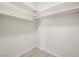 Walk-in closet with white shelving and light wood-look floors at 908 Primrose Ln, Henderson, NV 89011