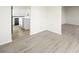 Dining area with light wood floors and view into the kitchen at 908 Primrose Ln, Henderson, NV 89011