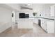 Bright kitchen featuring white cabinets and a breakfast bar at 908 Primrose Ln, Henderson, NV 89011