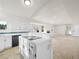 Spacious kitchen with white cabinets, an island, and hardwood floors at 908 Primrose Ln, Henderson, NV 89011