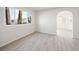 Light and airy living room with wood-look flooring and large window at 908 Primrose Ln, Henderson, NV 89011