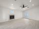 Living room with fireplace, wood-look floors, and sliding glass doors at 908 Primrose Ln, Henderson, NV 89011