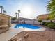 Inviting kidney-shaped pool with a spa in the backyard at 908 Primrose Ln, Henderson, NV 89011