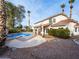 Inviting pool and patio area with covered seating at 908 Primrose Ln, Henderson, NV 89011