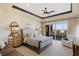 Main bedroom with plush bed and private balcony access at 9204 Tesoras Dr # 401, Las Vegas, NV 89144