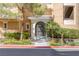 Elegant building entrance with gated access and landscaping at 9204 Tesoras Dr # 401, Las Vegas, NV 89144