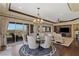 Elegant dining area with hardwood floors and chandelier at 9204 Tesoras Dr # 401, Las Vegas, NV 89144