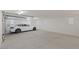 Spacious two-car garage with epoxy flooring and EV charger at 9204 Tesoras Dr # 401, Las Vegas, NV 89144