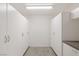 Garage with ample built-in storage cabinets at 9204 Tesoras Dr # 401, Las Vegas, NV 89144