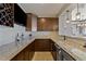 Modern wet bar featuring granite countertops and ample cabinet space at 9204 Tesoras Dr # 401, Las Vegas, NV 89144