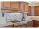 Gas cooktop and custom cabinetry in kitchen at 9204 Tesoras Dr # 401, Las Vegas, NV 89144