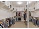 Large walk-in closet with custom shelving and hanging rods at 9204 Tesoras Dr # 401, Las Vegas, NV 89144