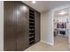 Custom-built Primary closet with shelving, drawers, and hanging space at 9204 Tesoras Dr # 401, Las Vegas, NV 89144