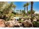 Landscaped courtyard with a tranquil water feature at 9204 Tesoras Dr # 401, Las Vegas, NV 89144