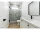 Clean bathroom with white vanity, quartz countertop and a walk-in shower at 10505 Novella Ct, Las Vegas, NV 89135