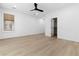 Well-lit bedroom with wood-look floors, a ceiling fan, and a closet at 10505 Novella Ct, Las Vegas, NV 89135