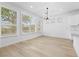 Modern dining room with hardwood floors and large windows at 10505 Novella Ct, Las Vegas, NV 89135