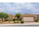 Single-story home with two-car garage and nicely landscaped yard at 10505 Novella Ct, Las Vegas, NV 89135