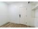 Bright storage room with white walls, light wood floors, and shelving at 10505 Novella Ct, Las Vegas, NV 89135