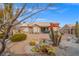 Landscaped backyard with cactus, gravel, and a pathway at 10813 Black Ledge Ave, Las Vegas, NV 89134