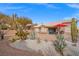 Landscaped backyard with gravel, cactus, and patio area at 10813 Black Ledge Ave, Las Vegas, NV 89134