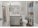 Clean bathroom with shower/tub combo and gray vanity at 10813 Black Ledge Ave, Las Vegas, NV 89134