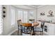 Cozy breakfast nook with a round table and four chairs, located near a window at 10813 Black Ledge Ave, Las Vegas, NV 89134