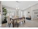 Bright dining room featuring a rustic wooden table with bench seating at 10813 Black Ledge Ave, Las Vegas, NV 89134