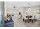 Spacious dining room with wood table and gray upholstered chairs and bench at 10813 Black Ledge Ave, Las Vegas, NV 89134