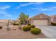 Single-story home with two-car garage and desert landscaping at 10813 Black Ledge Ave, Las Vegas, NV 89134