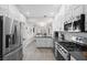 Updated kitchen featuring stainless steel appliances and white cabinetry at 10813 Black Ledge Ave, Las Vegas, NV 89134