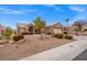 Modern kitchen with white cabinets, stainless steel appliances, and a large island at 10813 Black Ledge Ave, Las Vegas, NV 89134