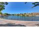 Scenic lake view with walking path and homes in background at 10813 Black Ledge Ave, Las Vegas, NV 89134