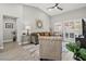 Living room with hardwood floors, comfy seating, and lots of natural light at 10813 Black Ledge Ave, Las Vegas, NV 89134