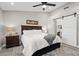 Main bedroom with king bed, barn door to bathroom, ceiling fan at 10813 Black Ledge Ave, Las Vegas, NV 89134