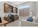 Home office with built-in wooden desk and shelving at 10813 Black Ledge Ave, Las Vegas, NV 89134