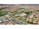 Aerial view of a community with houses, pool, and clubhouse at 1112 Via San Pietro, Henderson, NV 89011