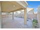 Covered patio with brick pavers and fire pit at 1112 Via San Pietro, Henderson, NV 89011