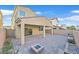 Home's backyard with covered patio and fire pit at 1112 Via San Pietro, Henderson, NV 89011