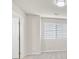 Bright bedroom with window blinds,door and closet at 1112 Via San Pietro, Henderson, NV 89011