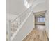 Elegant staircase with white railing and hardwood floors at 1112 Via San Pietro, Henderson, NV 89011