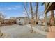 Spacious backyard with patio, shed, and mature trees at 1125 Neva Ranch Ave, North Las Vegas, NV 89081